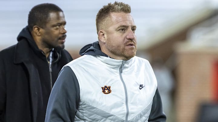 Jan 28, 2026; Mobile, AL, USA; Auburn head football coach Alex Golesh visits the field during American Senior Bowl practice at Hancock Whitney Stadium. Mandatory Credit: Vasha Hunt-Imagn Images