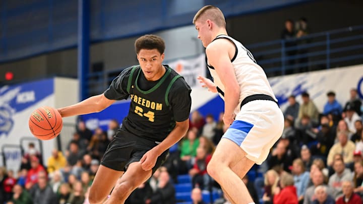 Freedom forward Donovan Davis (24) drives to the basket against the defense of Brookfield Central forward Henry Gruetzmacher (31) in the Rick Majerus WBY Shootout on Saturday, December 27, 2025, at Concordia University in Mequon, Wisconsin. Freedom won, 74-58. Freedom forward Donovan Davis (24) drives to the basket against the defense of Brookfield Central forward Henry Gruetzmacher (31) in the Rick Majerus WBY Shootout on Saturday, December 27, 2025, at Concordia University in Mequon, Wisconsin. Freedom won, 74-58.