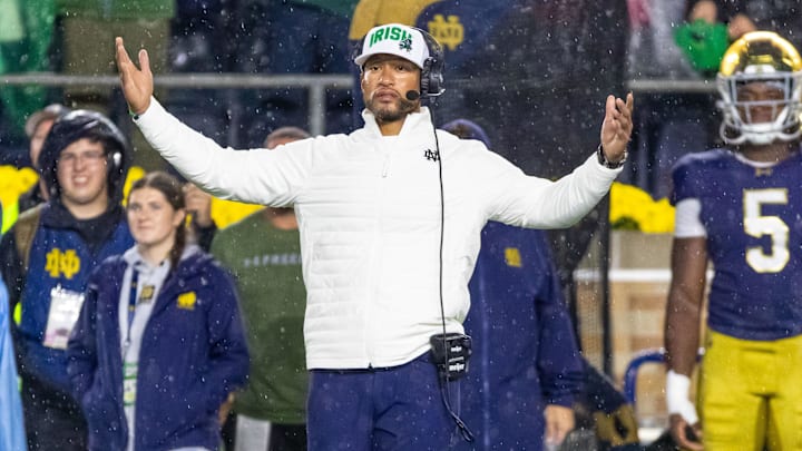Oct 18, 2025; South Bend, Indiana, USA;  Notre Dame Fighting Irish head coach Marcus Freeman reacts to the play against the USC Trojans.