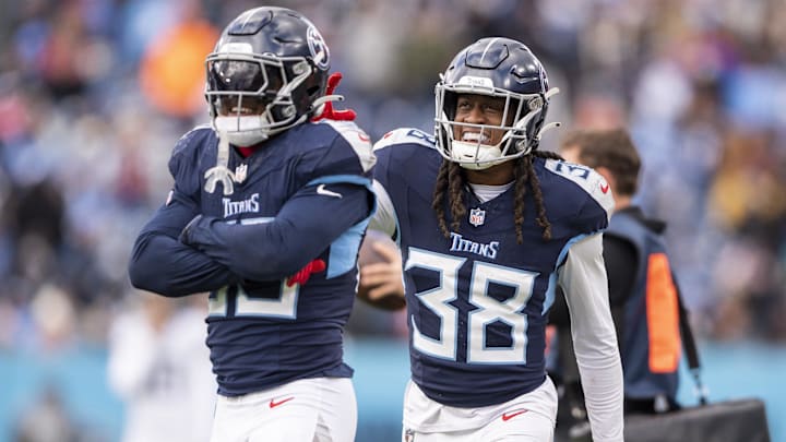 Jan 7, 2024; Nashville, Tennessee, USA;  Tennessee Titans safety K Von Wallace (35) and safety Terrell Edmunds (38) celebrate the big play against the Jacksonville Jaguars during the second half at Nissan Stadium. Mandatory Credit: Steve Roberts-Imagn Images