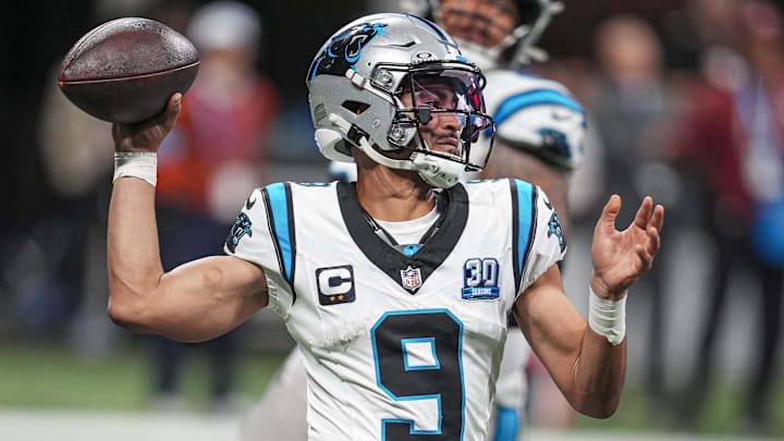 Carolina Panthers quarterback Bryce Young (9) passes on the run against the Atlanta Falcons during the second half at Mercedes-Benz Stadium.
