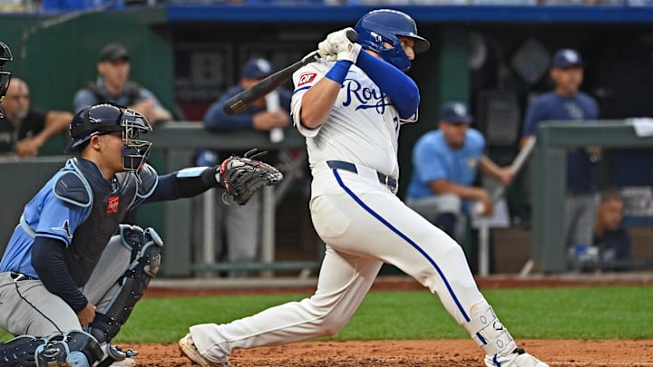 Jul 3, 2024; Kansas City, Missouri, USA; Kansas City Royals first base Vinnie Pasquantino (9) hits an RBI single in the third inning against the Tampa Bay Rays at Kauffman Stadium. Mandatory Credit: Peter Aiken-USA TODAY Sports