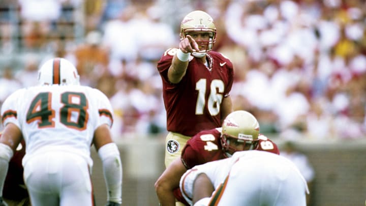 Oct 9, 1999; Tallahassee, FL, USA; FILE PHOTO; Florida State Seminoles quarterback Chris Weinke (16) points at Miami Hurricanes linebacker Chris Campbell (48) at Doak Campbell Stadium. Mandatory Credit: RVR Photos-Imagn Images 