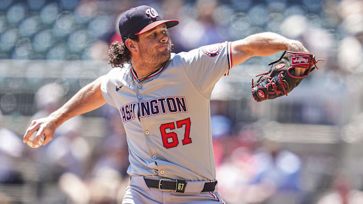 Aug 25, 2024; Cumberland, Georgia, USA; Washington Nationals relief pitcher Kyle Finnegan (67) pitches against the Atlanta Braves during the ninth inning at Truist Park. 