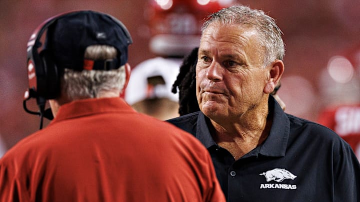 Former Arkansas Razorback head coach Sam Pittman consults with then offensive coordinator now head coach Bobby Petrino during last year's upset win over the Tennessee Volunteers at Donald W. Reynolds Razorback Stadium in Fayetteville. 