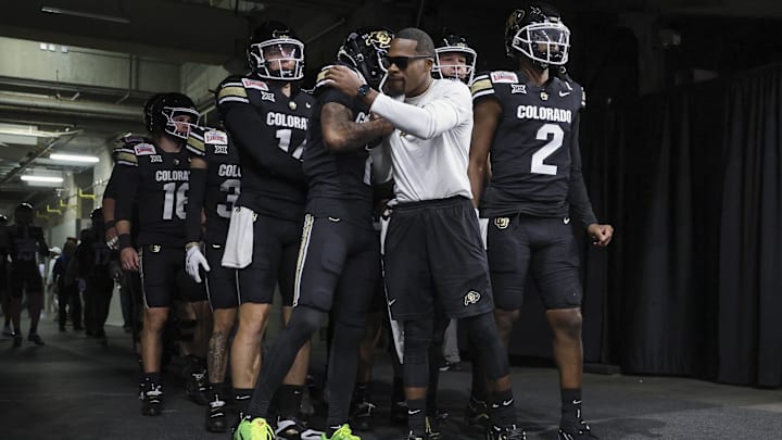 Dec 28, 2024; San Antonio, TX, USA; Colorado Buffaloes quarterback Shedeur Sanders (2) prepares to walk onto the field with teammates before the game against the Brigham Young Cougars at Alamodome.  