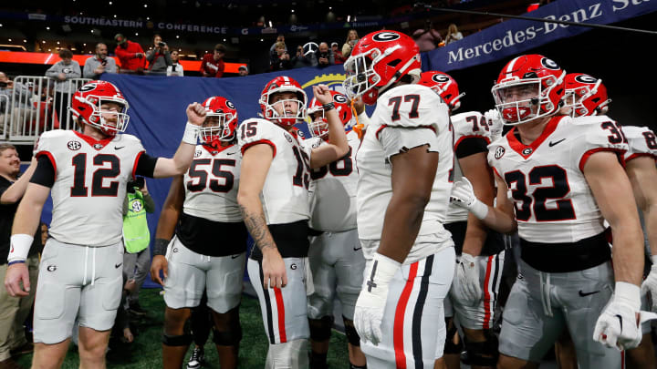 Georgia quarterback Carson Beck (15) huddles up the team before taking the field for warm ups before the start of the SEC Championship game against Alabama at Mercedes-Benz Stadium in Atlanta, on Saturday, Dec. 2, 2023. Georgia quarterback Carson Beck (15) huddles up the team before taking the field for warm ups before the start of the SEC Championship game against Alabama at Mercedes-Benz Stadium in Atlanta, on Saturday, Dec. 2, 2023.