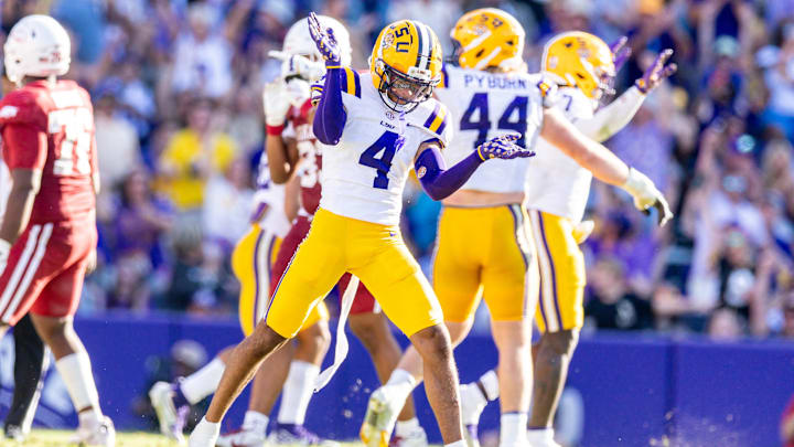 Nov 15, 2025; Baton Rouge, Louisiana, USA;  LSU Tigers cornerback Mansoor Delane (4) reacts to a stop on fourth down against the Arkansas Razorbacks during the second half at Tiger Stadium.