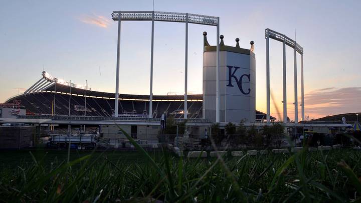 General view as the sun sets behind Kauffman Stadium