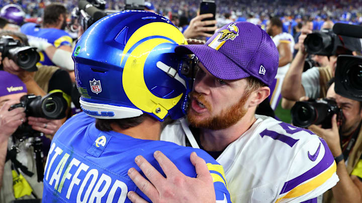 Minnesota Vikings quarterback Sam Darnold and Los Angeles Rams quarterback Matthew Stafford hug after the  NFC wild-card game at State Farm Stadium in Glendale, Ariz., on Jan. 13, 2025.