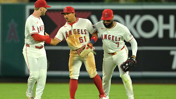 Jul 28, 2025; Anaheim, California, USA; Los Angeles Angels left fielder Taylor Ward (3), Los Angeles Angels center fielder Jo Adell (7) and Los Angeles Angels right fielder Gustavo Campero (51) head off the field after the final out of the ninth inning defeating the Texas Rangers at Angel Stadium. Mandatory Credit: Jayne Kamin-Oncea-Imagn Images