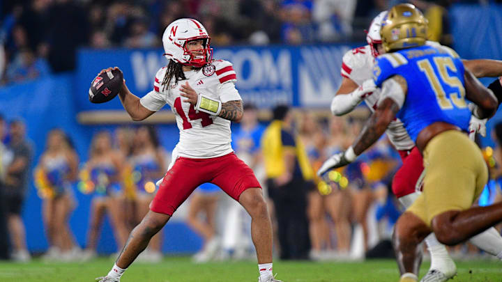 Nov 8, 2025; Pasadena, California, USA; Nebraska Cornhuskers quarterback TJ Lateef (14) throws against the UCLA Bruins during the second half at the Rose Bowl. Mandatory Credit: Gary A. Vasquez-Imagn Images