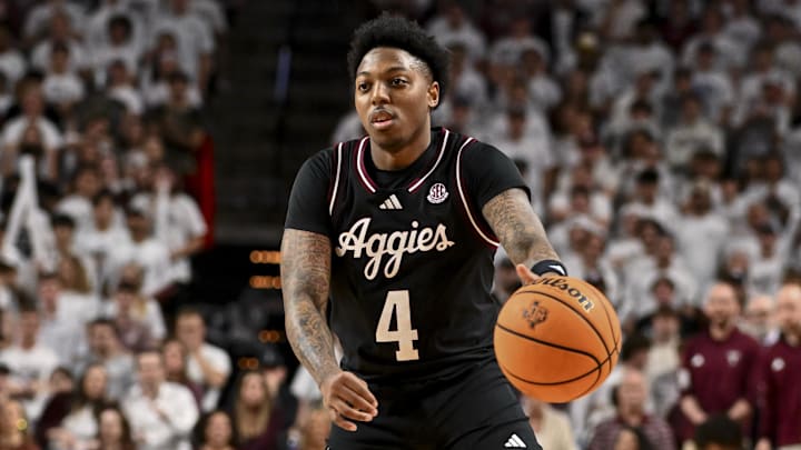 Mar 4, 2025; College Station, Texas, USA; Texas A&M Aggies guard Wade Taylor IV (4) passes the ball down court during the first half against the Auburn Tigers at Reed Arena. Mandatory Credit: Maria Lysaker-Imagn Images 