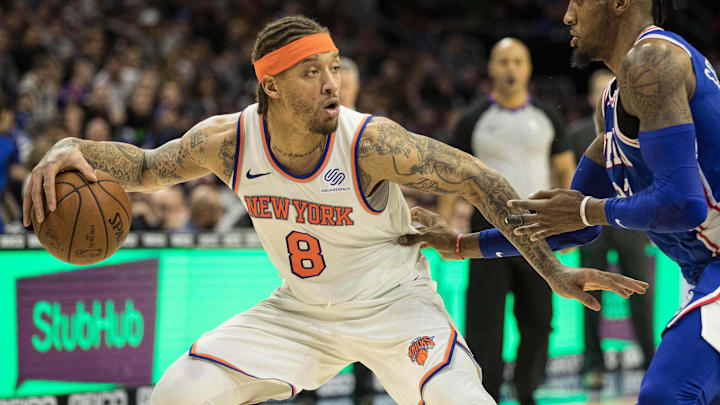 Mar 28, 2018; Philadelphia, PA, USA; New York Knicks forward Michael Beasley (8) controls the ball against Philadelphia 76ers forward Robert Covington (33) during the third quarter at Wells Fargo Center. Mandatory Credit: Bill Streicher-Imagn Images
