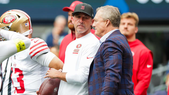 Sep 7, 2025; Seattle, Washington, USA; San Francisco 49ers general manager John Lynch, right, talks with head coach Kyle Shanahan during pregame warmups against the Seattle Seahawks at Lumen Field. Mandatory Credit: Joe Nicholson-Imagn Images