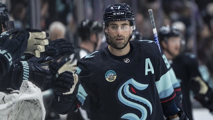 Mar 26, 2024; Seattle, Washington, USA; Seattle Kraken forward Jordan Eberle (7) is congratulated by teammates on the bench after scoring a power-play goald during the first period at Climate Pledge Arena. Mandatory Credit: Stephen Brashear-Imagn Images