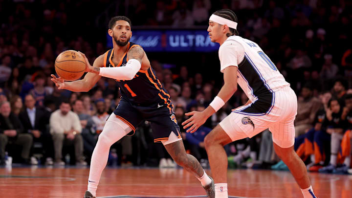 New York Knicks guard Cameron Payne (1) looks to pass the ball against Orlando Magic guard Anthony Black (0) during the third quarter at Madison Square Garden.