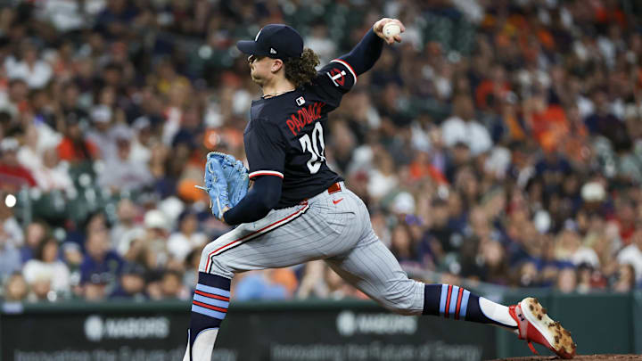 Jun 13, 2025; Houston, Texas, USA; Minnesota Twins starting pitcher Chris Paddack (20) pitches against the Houston Astros in the first inning at Daikin Park.