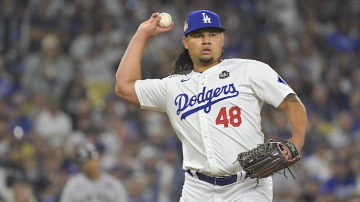 Oct 25, 2024; Los Angeles, California, USA; Los Angeles Dodgers relief pitcher Brusdar Graterol (48) throws to first base for an out in the seventh inning against the New York Yankees during game one of the 2024 MLB World Series at Dodger Stadium. Mandatory Credit: Jayne Kamin-Oncea-Imagn Images Oct 25, 2024; Los Angeles, California, USA; Los Angeles Dodgers relief pitcher Brusdar Graterol (48) throws to first base for an out in the seventh inning against the New York Yankees during game one of the 2024 MLB World Series at Dodger Stadium. Mandatory Credit: Jayne Kamin-Oncea-Imagn Images