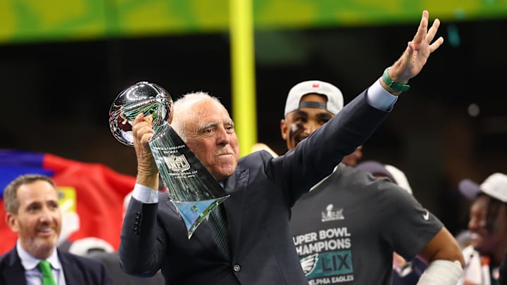 Feb 9, 2025; New Orleans, LA, USA; Philadelphia Eagles owner Jeffrey Lurie hoists the Vince Lombardi Trophy after defeating the Kansas City Chiefs in Super Bowl LIX at Ceasars Superdome.