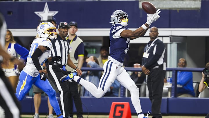 Dallas Cowboys WR George Pickens catches a touchdown pass against Los Angeles Chargers CB Cam Hart.