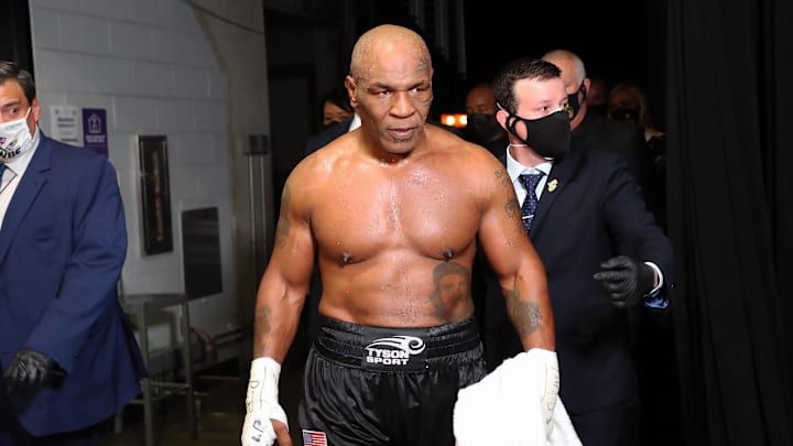 Mike Tyson exits the ring after his split draw against Roy Jones, Jr. during a November 2020 heavyweight exhibition boxing bout for the WBC Frontline Belt at the Staples Center.