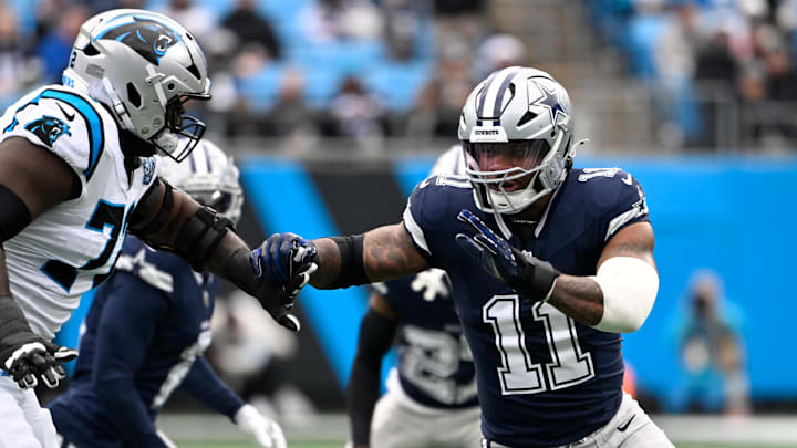 Dec 15, 2024; Charlotte, North Carolina, USA;  Dallas Cowboys linebacker Micah Parsons (11) rushes as Carolina Panthers offensive tackle Taylor Moton (72) defends in the first quarter at Bank of America Stadium. Mandatory Credit: Bob Donnan-Imagn Images