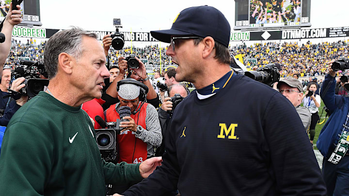 Oct 29, 2016; East Lansing, MI, USA; Michigan State Spartans head coach Mark Dantonio (left) shakes