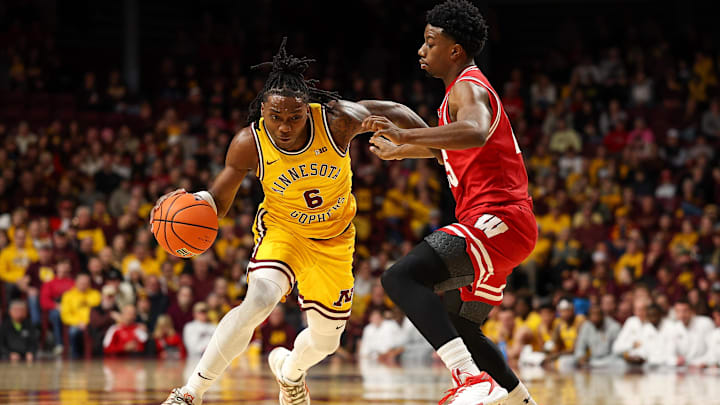 Jan 13, 2026; Minneapolis, Minnesota, USA; Minnesota Golden Gophers guard Langston Reynolds (6) works around Wisconsin Badgers guard John Blackwell (25) during the first half at Williams Arena. Mandatory Credit: Matt Krohn-Imagn Images