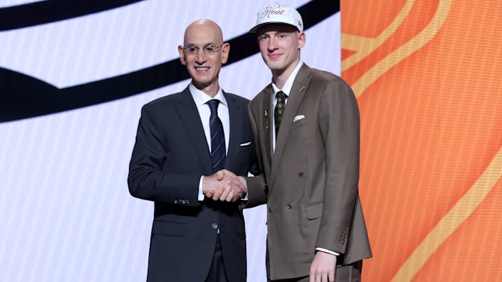 Jun 25, 2025; Brooklyn, NY, USA; Kasparas Jakucionis stands with NBA commissioner Adam Silver after being selected as the 20th pick by the Miami Heat in the first round of the 2025 NBA Draft at Barclays Center. Mandatory Credit: Brad Penner-Imagn Images Jun 25, 2025; Brooklyn, NY, USA; Kasparas Jakucionis stands with NBA commissioner Adam Silver after being selected as the 20th pick by the Miami Heat in the first round of the 2025 NBA Draft at Barclays Center. Mandatory Credit: Brad Penner-Imagn Images