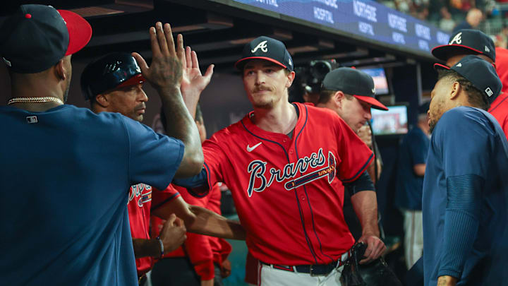 Sep 27, 2024; Atlanta, Georgia, USA; Atlanta Braves starting pitcher Max Fried (54) is congratulated by teammates after being removed from a game against the Kansas City Royals in the ninth inning at Truist Park. Mandatory Credit: Brett Davis-Imagn Images