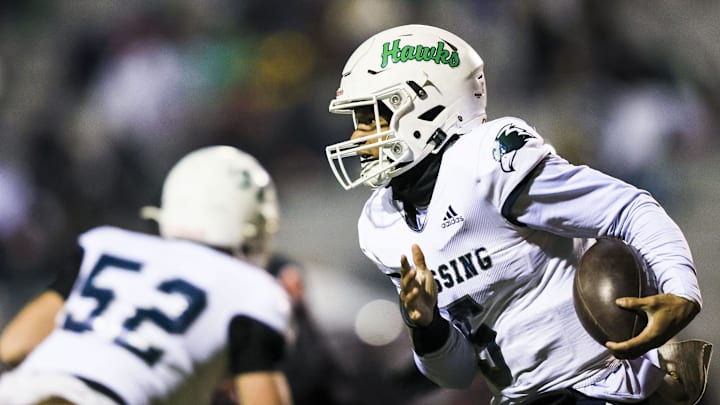 Great Crossing quarterback Jeremiah Clark (5) runs with the ball against Ryle in the first half at Ryle High School Nov. 29, 2024.