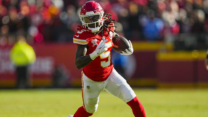Dec 21, 2024; Kansas City, Missouri, USA; Kansas City Chiefs wide receiver Hollywood Brown (5) runs with the ball during the first half against the Houston Texans at GEHA Field at Arrowhead Stadium. Mandatory Credit: Jay Biggerstaff-Imagn Images