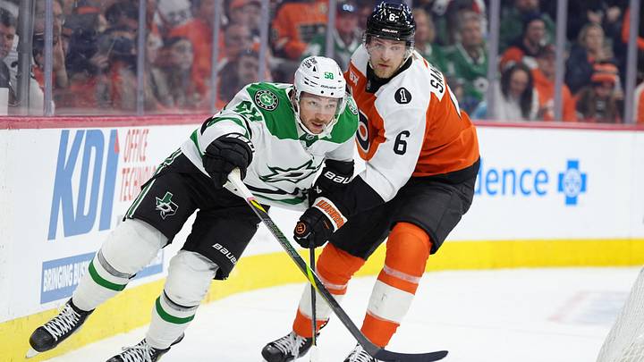 Mar 29, 2026; Philadelphia, Pennsylvania, USA; Dallas Stars left wing Michael Bunting (58) battles for position against Philadelphia Flyers defenseman Travis Sanheim (6) in the first period at Xfinity Mobile Arena.