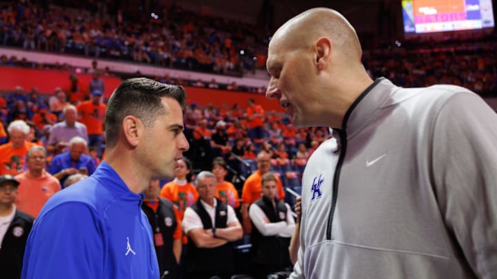 Feb 14, 2026; Gainesville, Florida, USA; Florida Gators head coach Todd Golden and Kentucky Wildcats head coach Mark Pope talk before a game at Exactech Arena at the Stephen C. O'Connell Center. Mandatory Credit: Matt Pendleton-Imagn Images