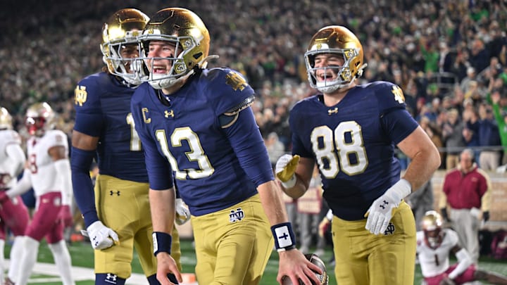Nov 9, 2024; South Bend, Indiana, USA; Notre Dame Fighting Irish quarterback Riley Leonard (13) celebrates after a touchdown against the Florida State Seminoles during the first quarter at Notre Dame Stadium. Nov 9, 2024; South Bend, Indiana, USA; Notre Dame Fighting Irish quarterback Riley Leonard (13) celebrates after a touchdown against the Florida State Seminoles during the first quarter at Notre Dame Stadium.