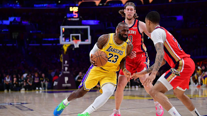 Mar 4, 2025; Los Angeles, California, USA: Los Angeles Lakers forward LeBron James (23) moves the ball against New Orleans Pelicans forward Kelly Olynyk (13) and guard Trey Murphy III (25) during the first half at Crypto.com Arena. Mandatory Credit: Gary A. Vasquez-Imagn Images