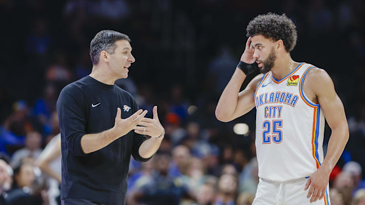 Oct 9, 2024; Oklahoma City, Oklahoma, USA; Oklahoma City Thunder head coach Mark Daigneault talks to guard Ajay Mitchell (25) during a break in play in the second half at Paycom Center. Mandatory Credit: Alonzo Adams-Imagn Images