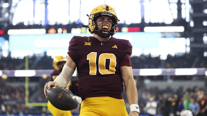 Dec 7, 2024; Arlington, TX, USA; Arizona State Sun Devils quarterback Sam Leavitt (10) reacts after running for a touchdown during the first quarter against the Iowa State Cyclones at AT&T Stadium. Mandatory Credit: Kevin Jairaj-Imagn Images Dec 7, 2024; Arlington, TX, USA; Arizona State Sun Devils quarterback Sam Leavitt (10) reacts after running for a touchdown during the first quarter against the Iowa State Cyclones at AT&T Stadium. Mandatory Credit: Kevin Jairaj-Imagn Images
