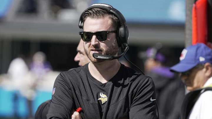 (EDITORS NOTE: caption correction) Oct 17, 2021; Charlotte, North Carolina, USA; Minnesota Vikings quarterbacks coach Andrew Janocko on the sidelines during the first quarter against the Carolina Panthers at Bank of America Stadium. Mandatory Credit: Jim Dedmon-Imagn Images (EDITORS NOTE: caption correction) Oct 17, 2021; Charlotte, North Carolina, USA; Minnesota Vikings quarterbacks coach Andrew Janocko on the sidelines during the first quarter against the Carolina Panthers at Bank of America Stadium. Mandatory Credit: Jim Dedmon-Imagn Images