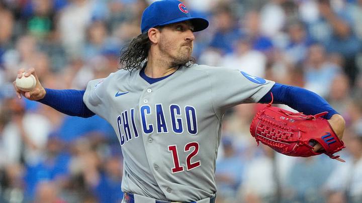 Aug 7, 2026; Kansas City, Missouri, USA; Chicago Cubs starting pitcher Kevin Gausman (12) delivers a pitch against the Kansas City Royals during the first inning at Kauffman Stadium. Mandatory Credit: Denny Medley-Imagn Images