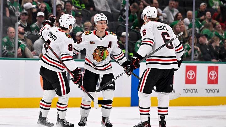 Mar 8, 2026; Dallas, Texas, USA; Chicago Blackhawks center Ryan Donato (8) and center Connor Bedard (98) and defenseman Sam Rinzel (6) celebrate a goal during the game between the Stars and the Blackhawks at American Airlines Center. Mandatory Credit: Jerome Miron-Imagn Images