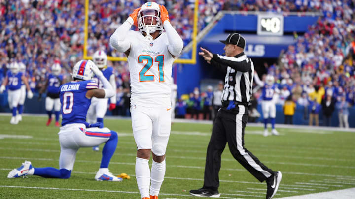 Miami Dolphins safety Jordan Poyer (21) reacts to getting penalized on a a hit against Buffalo Bills wide receiver Keon Coleman (0) during the second half at Highmark Stadium.