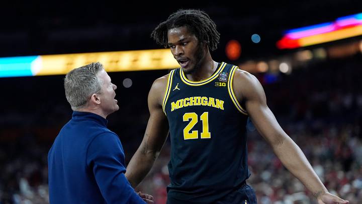 Michigan head coach Dusty May speaks with Michigan forward Morez Johnson Jr. (21) in the first half of their Final Four game against Arizona at Lucas Oil Stadium in Indianapolis on Saturday, April 4, 2026. Michigan head coach Dusty May speaks with Michigan forward Morez Johnson Jr. (21) in the first half of their Final Four game against Arizona at Lucas Oil Stadium in Indianapolis on Saturday, April 4, 2026.