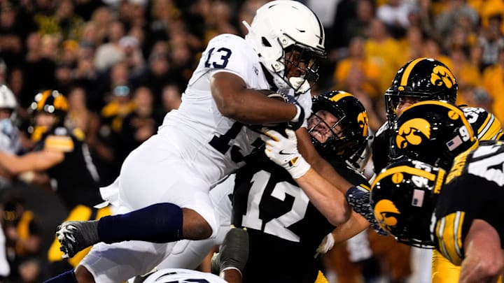 Penn State running back Kaytron Allen dives into the pile against the Iowa Hawkeyes at Kinnick Stadium.