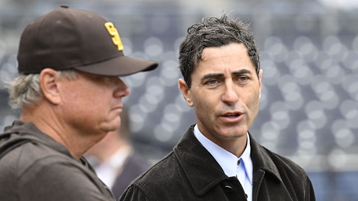 Mar 27, 2025; San Diego, California, USA; San Diego Padres general manager A.J. Preller, right, talks with manager Mike Shildt before an Opening Day baseball game between the San Diego Padres and the Atlanta Braves at Petco Park. 