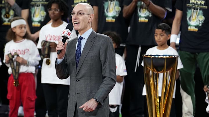 NBA commissioner Adam Silver presents the trophy to the Milwaukee Bucks NBA commissioner Adam Silver presents the trophy to the Milwaukee Bucks