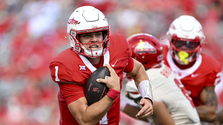 Oct 18, 2025; Houston, Texas, USA; Houston Cougars quarterback Conner Weigman (1) runs the ball into the end zone for a touchdown during the second quarter against the Arizona Wildcats at TDECU Stadium. Mandatory Credit: Maria Lysaker-Imagn Images 