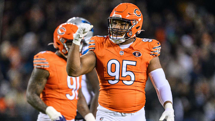 Nov 9, 2023; Chicago, Illinois, USA; Chicago Bears defensive lineman DeMarcus Walker (95) celebrates a defensive play against the Carolina Panthers during the second quarter at Soldier Field.