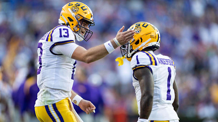 Nov 16, 2024; Gainesville, Florida, USA; LSU Tigers quarterback Garrett Nussmeier (13) celebrates with wide receiver Aaron Anderson (1) after a touchdown against the Florida Gators during the first half at Ben Hill Griffin Stadium. Mandatory Credit: Matt Pendleton-Imagn Images Nov 16, 2024; Gainesville, Florida, USA; LSU Tigers quarterback Garrett Nussmeier (13) celebrates with wide receiver Aaron Anderson (1) after a touchdown against the Florida Gators during the first half at Ben Hill Griffin Stadium. Mandatory Credit: Matt Pendleton-Imagn Images